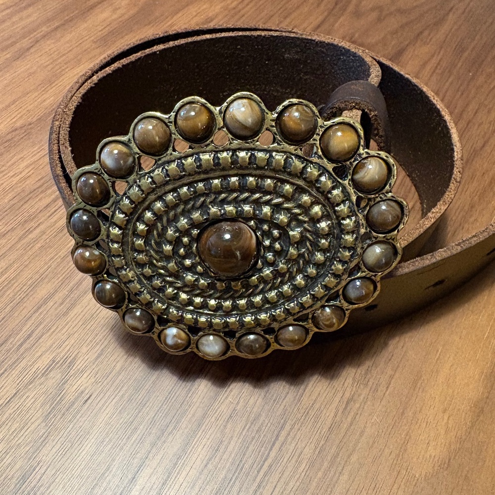 Leather belt with heavy brass and “stones” buckle